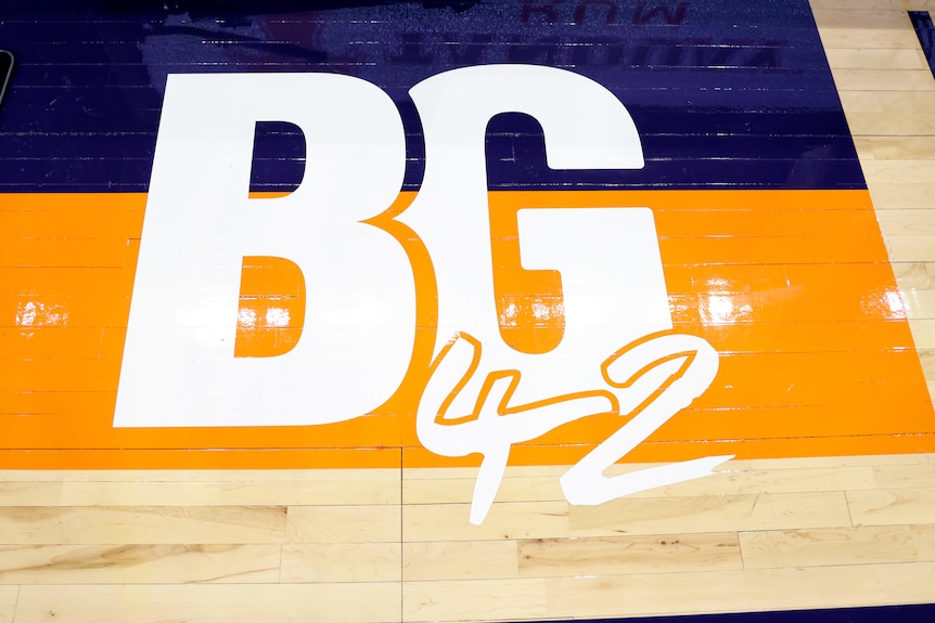 A decal showing BG42 in white letters on a blue and orange background