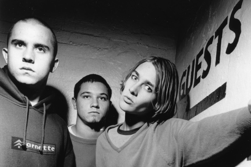 the members of silverchair, Ben Gillies, Chris Joannou and Daniel Johns, standing together in 1997
