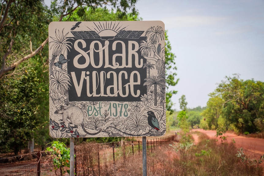 A hand painted sign at the start of the solar village at Humpty Doo.