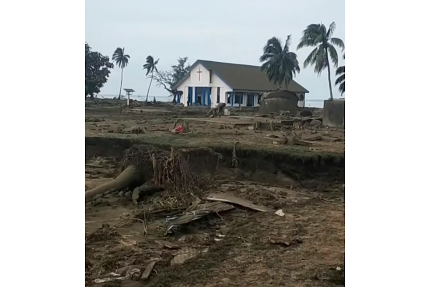 A damaged Mormon church surrounded by debris in Tonga