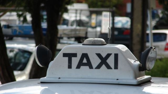 Taxi sign on the roof of a cab