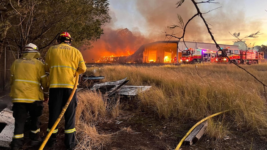 Image of fire fighters at scene of factory fire in NSW