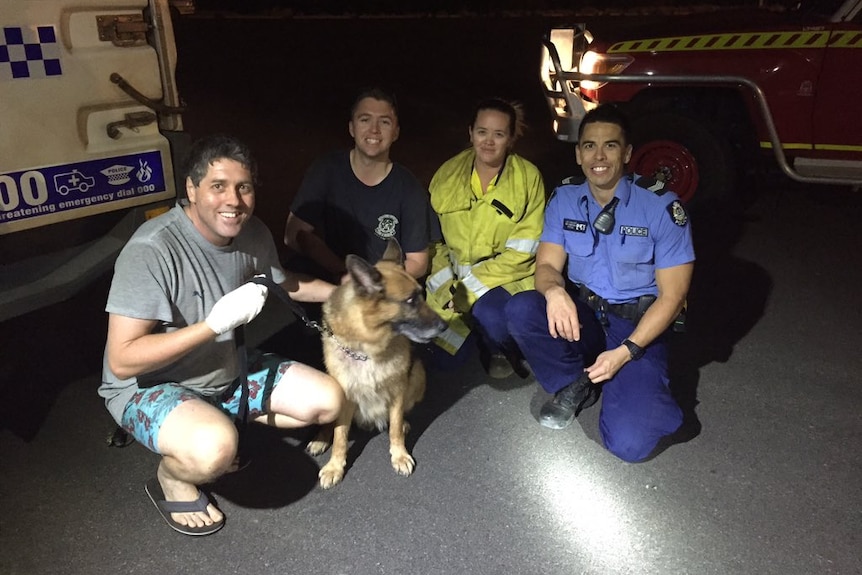 Cortlan Bennett and his dog Indi with rescuers.