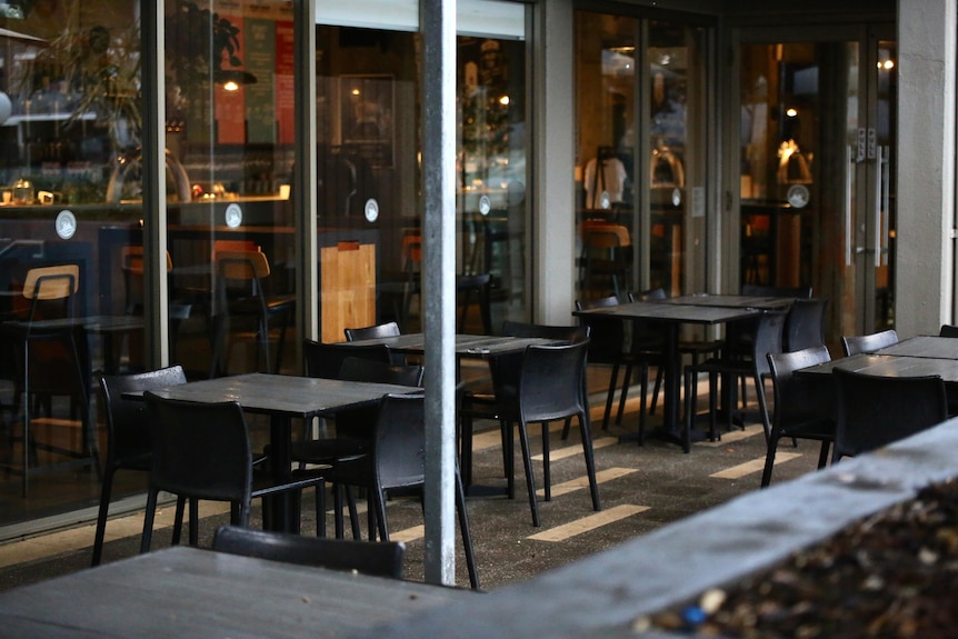 Empty tables and chairs at a brewery restaurant.