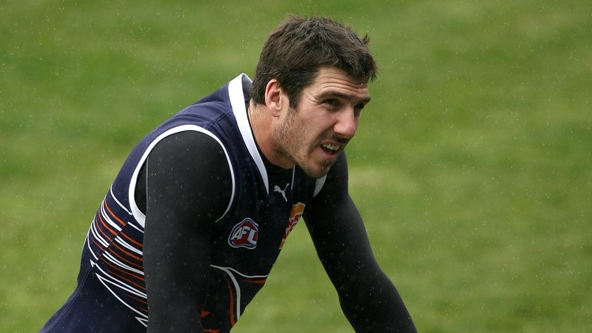 Quinten Lynch warms up at an Eagles training session.