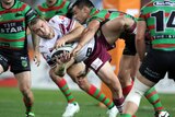 Manly's Kieran Foran is tackled by the Rabbitohs defence in the preliminary final.