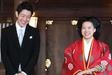 Japanese Princess Ayako, right, dressed in traditional ceremonial robe, and groom Kei Moriya, left.