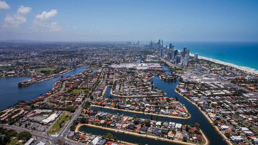 An aerial shot of a city on the ocean.