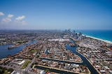 An aerial view of homes and high rise apartments on the Gold Coast's beaches and canals