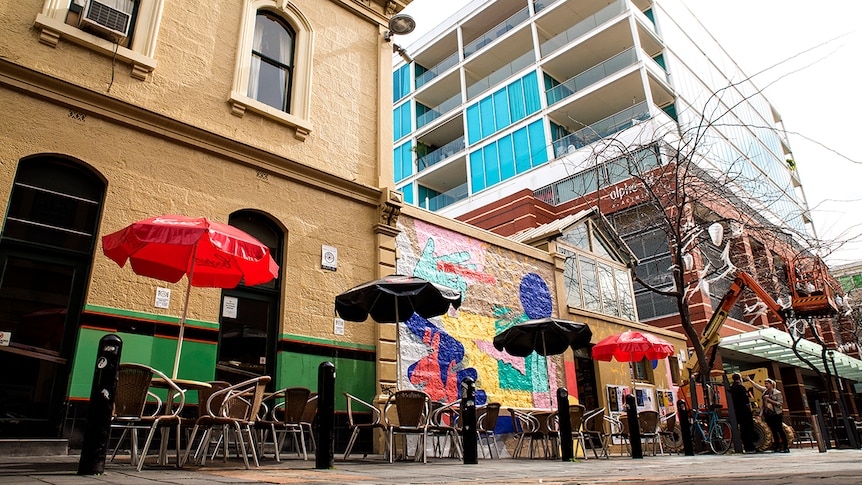 An apartment building out the back of a pub.