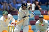 Vijay defends on day one at the Gabba