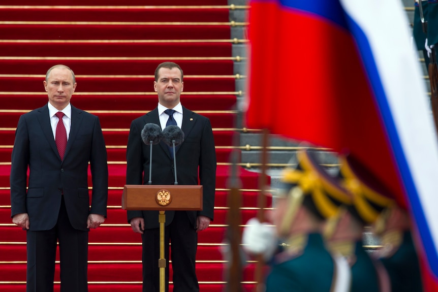 Putin and Medvedev standing next to each other. 