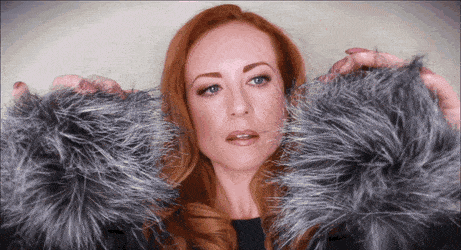 Gif of a women brushing fluffy microphones with her hands illustrating ASMR (Autonomous sensory meridian response) Culture