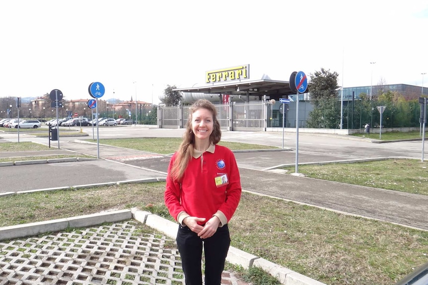 Queenslander Bronwyn Sims, a composite laminator at Ferrari HQ in Italy, outside the company's workers entrance at Maranello