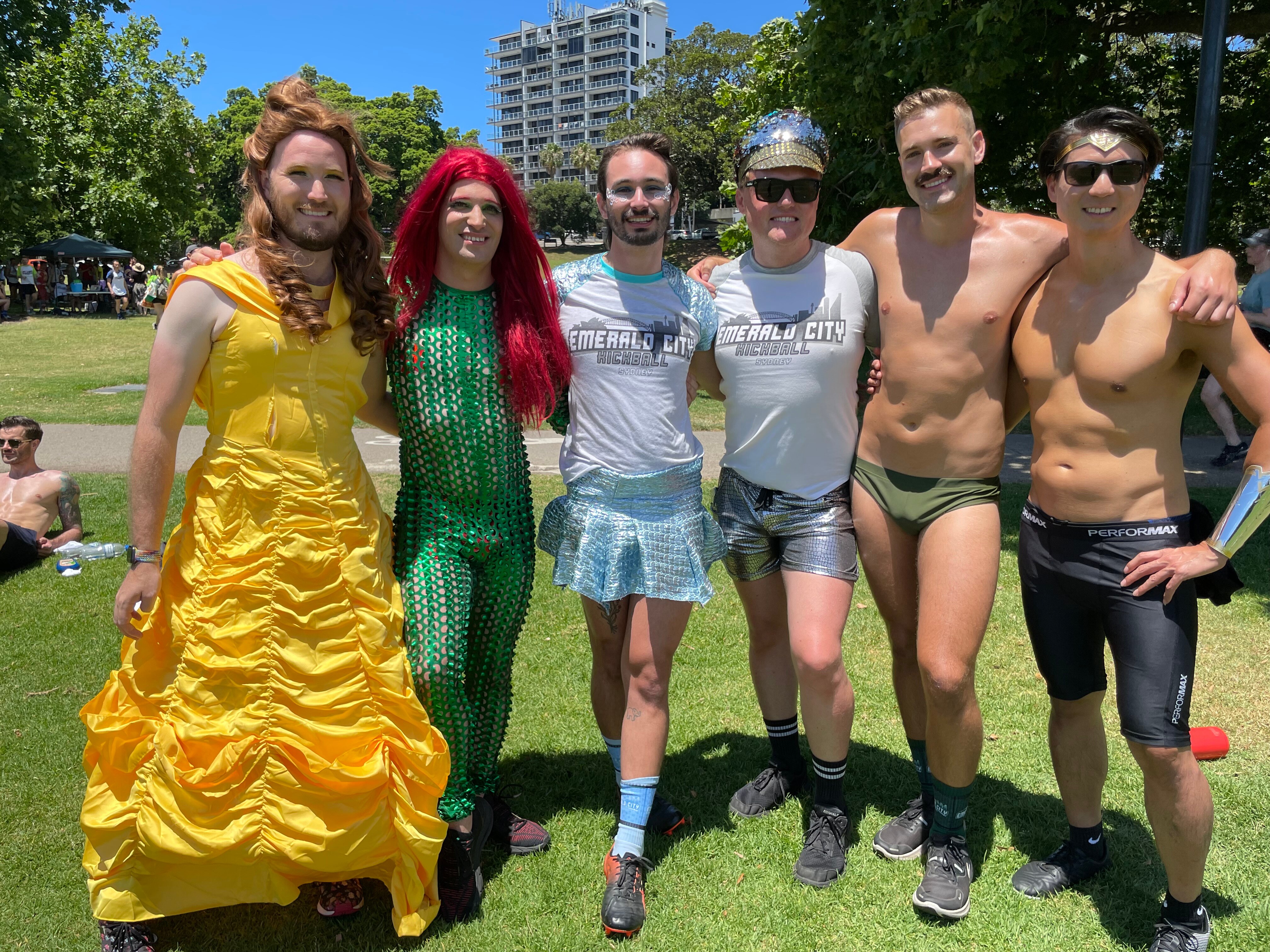 A group of players dressed in costumes including Beauty from Beauty and the Beast and Poison Ivy.