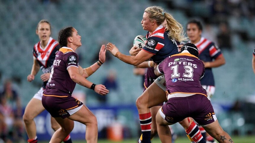 Experienced Roosters forward Ruan Sims is tackled by Brisbane's Rona Peters during the loss to the Broncos.