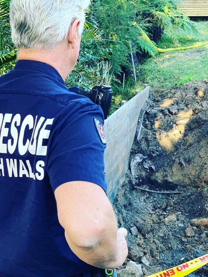 A Fire and Rescue worker uses electronic material to fight an underground coal wash fire.