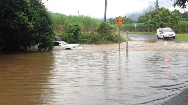 Car stuck in flooded causeway near Cairns. Friday Mar 21, 2014