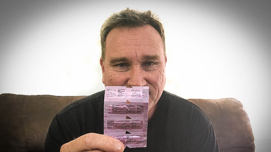 Craig Johnson holding packet of keto strips