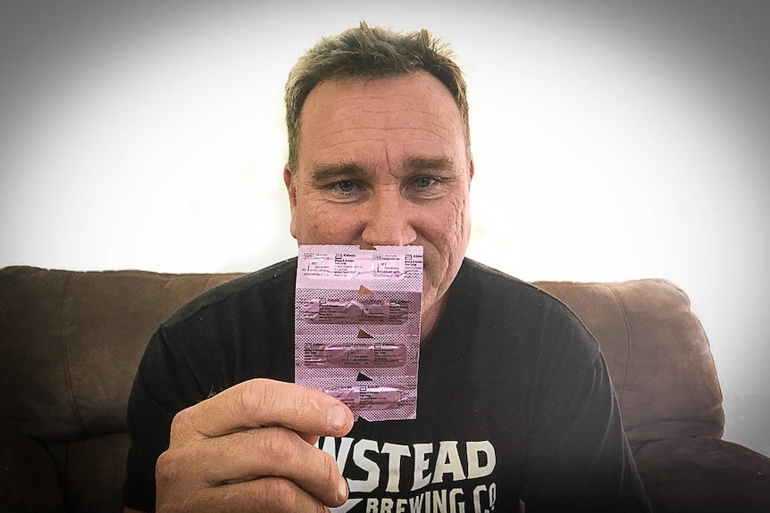 Craig Johnson holding packet of keto strips