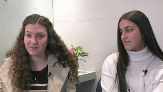 Two teenager girls sit for interview