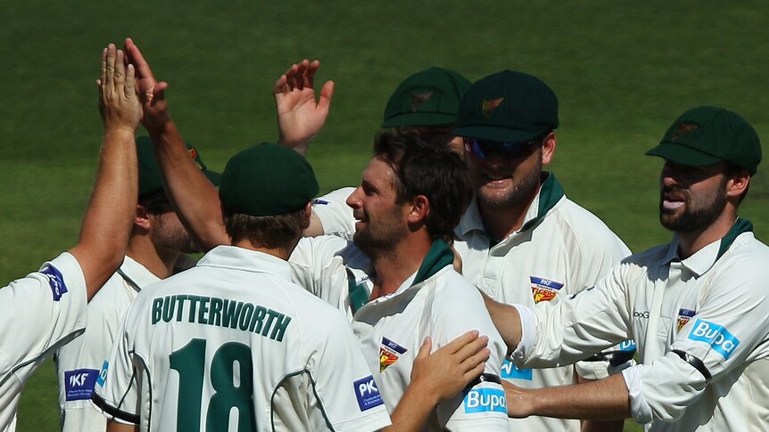 On song ... Ben Hilfenhaus celebrates with team-mates after taking a wicket (Chris Hyde: Getty Images)
