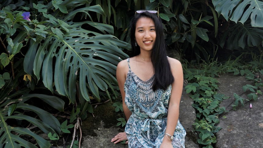 Mellisa Ma sitting in front of plants, in a story about peer-to-peer lending.