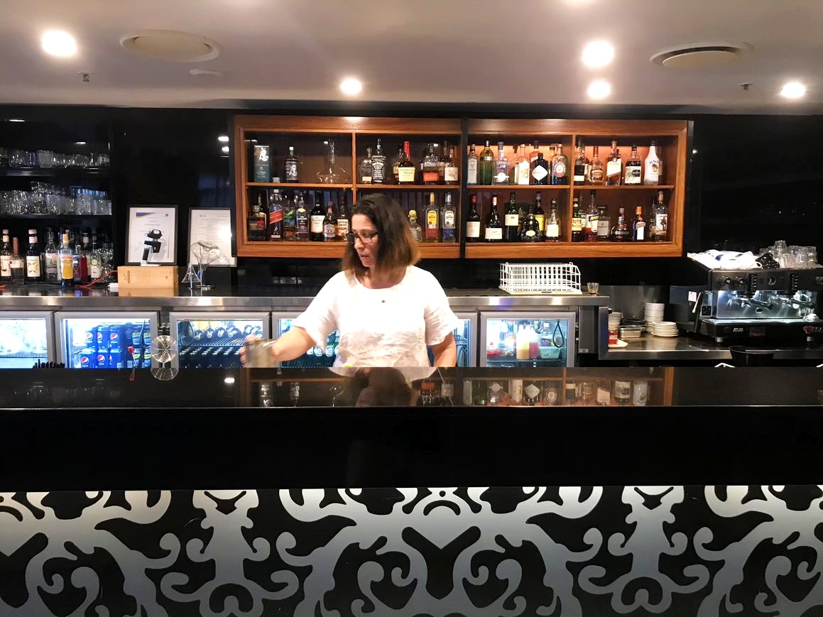 Angelica Jolly behind the bar.