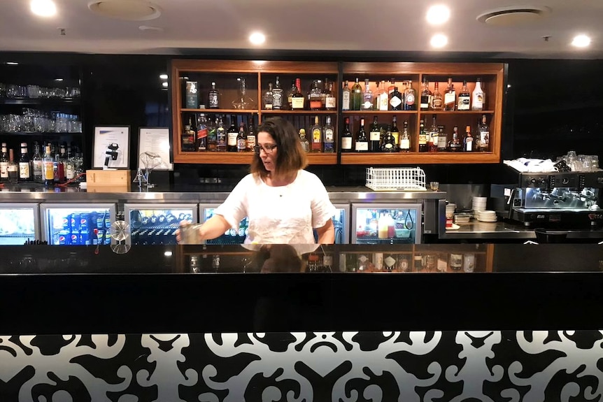 Angelica Jolly behind the bar.