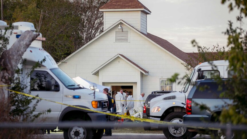 Investigators work at the scene of a deadly shooting at a church in Texas.