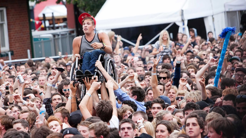 Dylan Alcott crowd-surfing at Laneway Festival.
