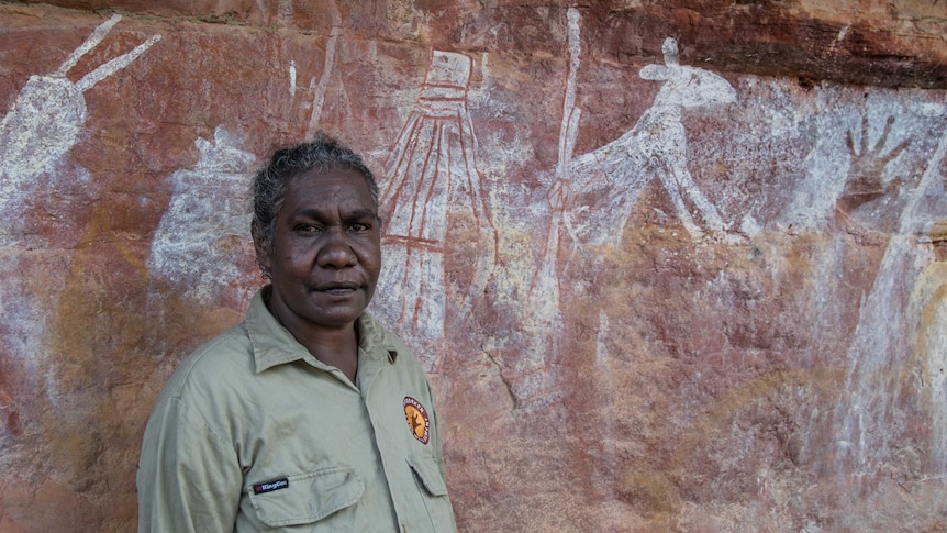 Ranger Serena Namarnyilk Yibarbuk with some of the rock art.