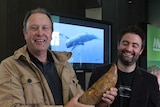 Murray Orr holds a fossil Whale tooth
