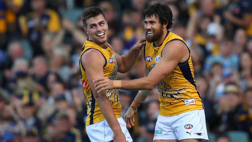 Fraser McInnes and Josh Kennedy celebrate a goal for the West Coast Eagles against Geelong.