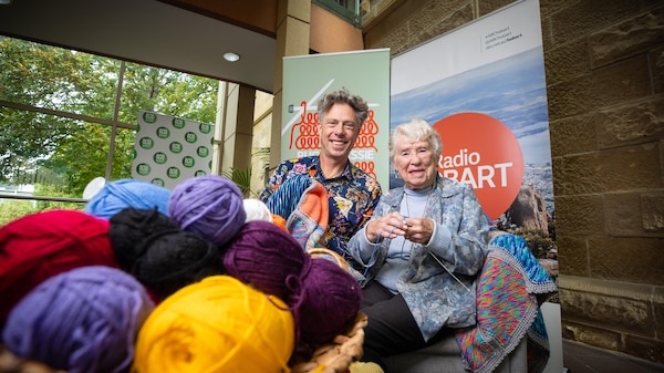 Ryk Goddard and Nola pose for Rug Up Tassie