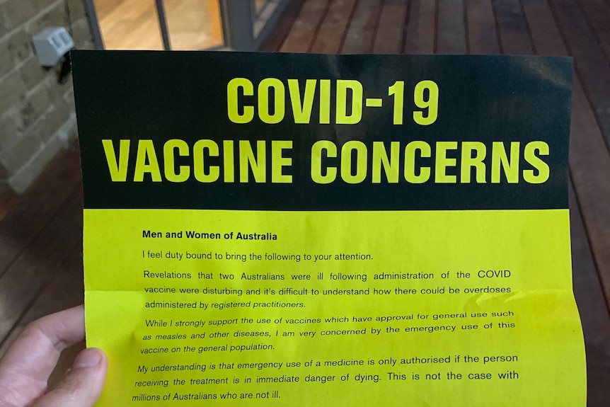 A yellow and black flyer titled "COVID-19 vaccine concerns" is signed by Clive Palmer