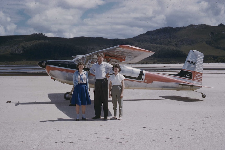 Lloyd Jones at Lake Pedder beach with daughter Jenny, left, and Jenny's friend