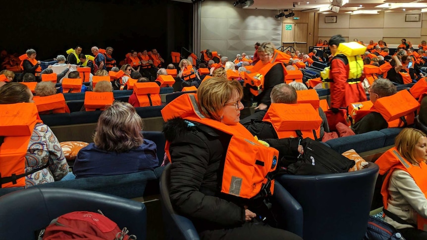 Passengers on board the Viking Sky wait to be evacuated off the coast of Norway.
