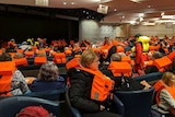 Passengers on board the Viking Sky wait to be evacuated off the coast of Norway.