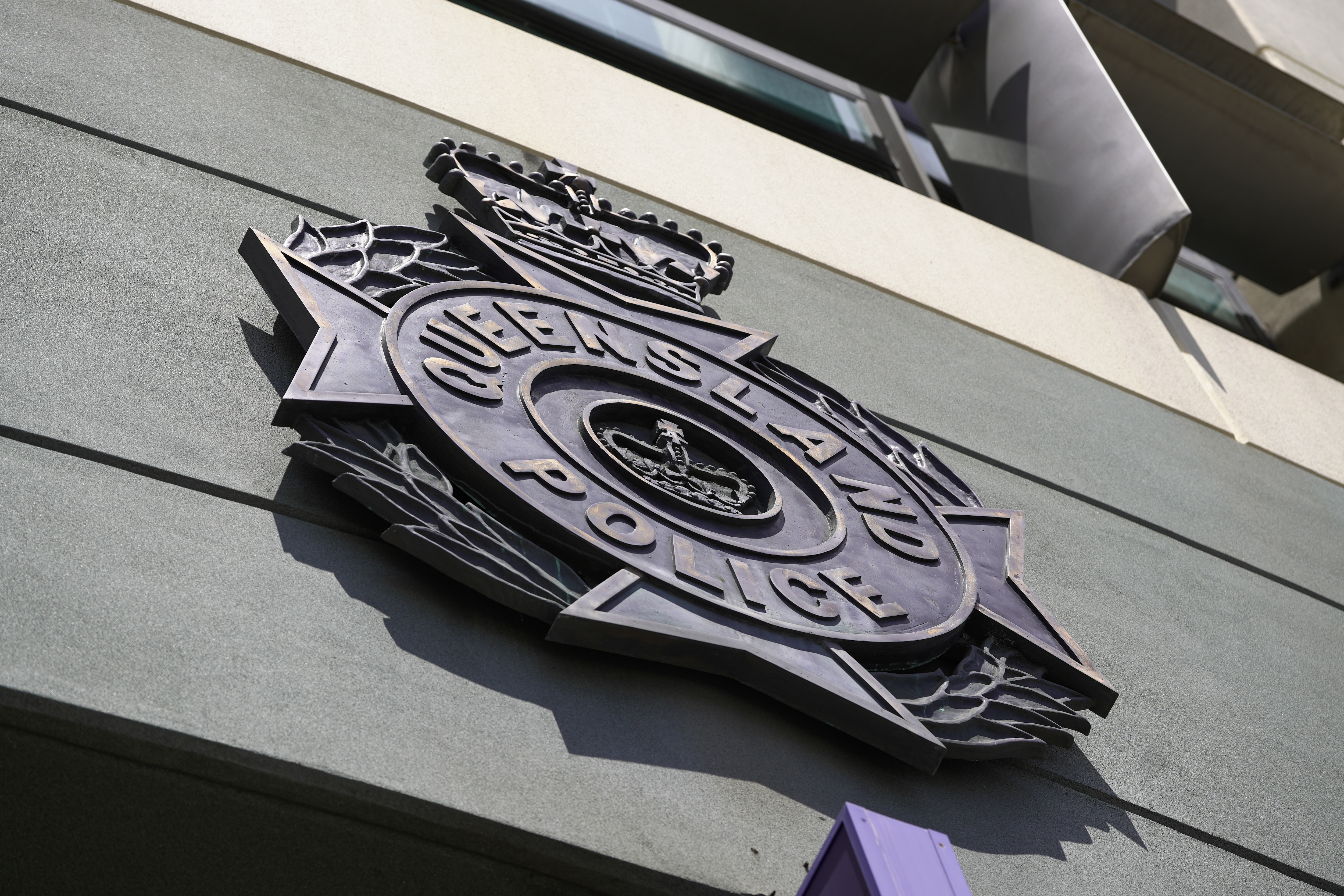Close up of the police logo on a building.