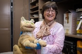 Woman holding a cat puppet