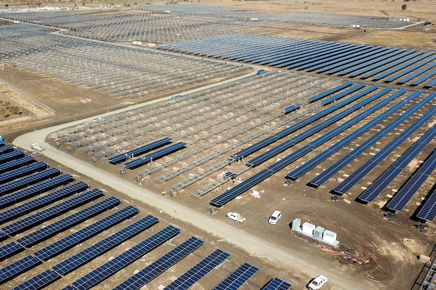 A drone shot of a large solar farm half completed.