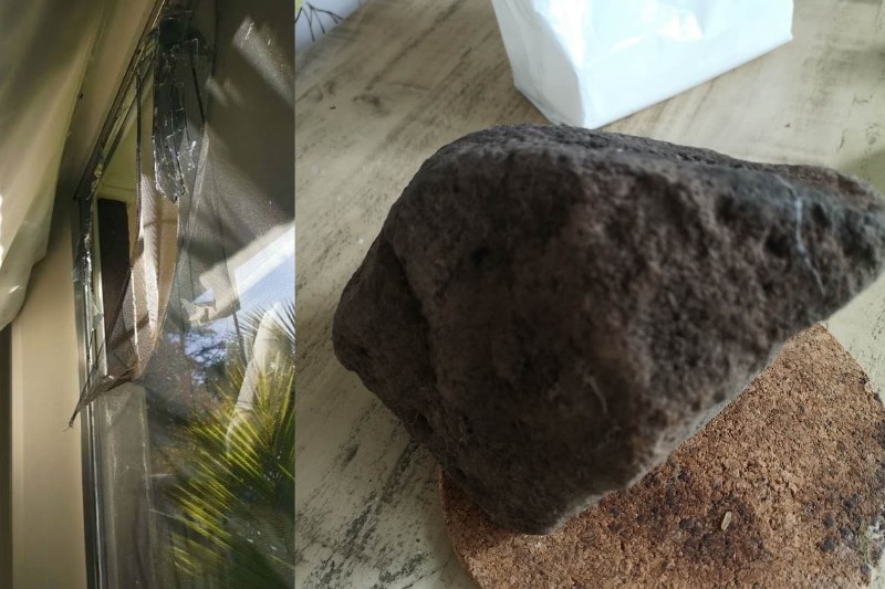 A broken window is shown on the left in this composite image, and a large rock is shown on a coaster on a table on the right.