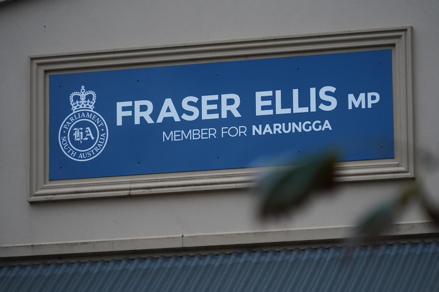 A blue sign which says 'Fraser Ellis MP Member for Narungga'. 