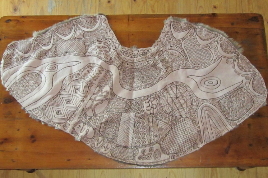 Lee Darroch's kangaroo cloak tells the story of the bogong moth.
