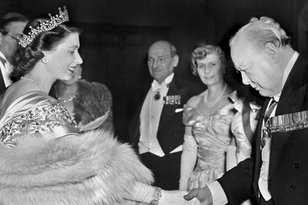 Queen Elizabeth ll shakes the hand of Winston Churchill.