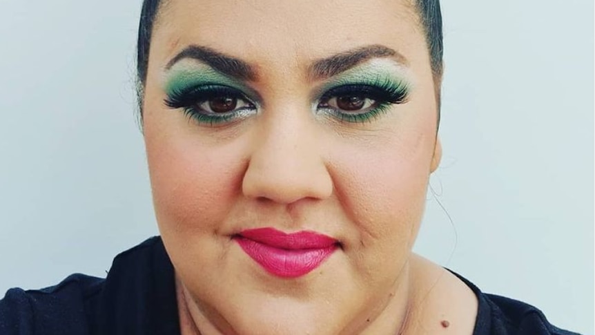 Steph Tisdell closeup wearing bright makeup