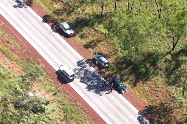 An aerial view from the CareFlight rescue helicopter of a Stuart Highway rollover in which two tourists were injured.