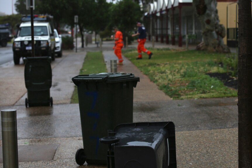 SES search crew and tipped-over bins