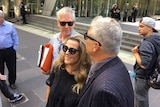 Michael Lawler, Kathy Jackson and a supporter leave court